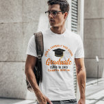 Orange Script Graduate Custom 2025 Graduation T-Shirt<br><div class="desc">These modern orange script custom senior graduate t-shirts feature your high school or college name for the class of 2025. Customize with your graduating year under the chic handwritten script and black grad cap for a great personalized graduation party tee.</div>
