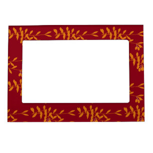 Orange silhouette branch leaves on red magnetic frame