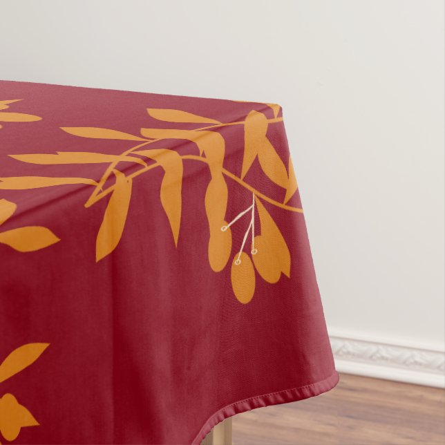 Orange silhouette branch leaves on red tablecloth (In Situ)
