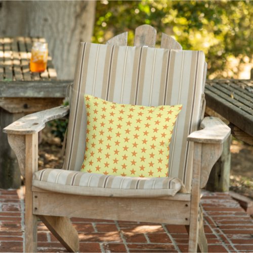 Orange stars pattern light yellow outdoor pillow