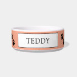 Orange "Teddy" Paw Print Pet Bowl<br><div class="desc">Treat your furry friend to their very own personalized bowl! This adorable ceramic pet bowl features a charming paw print design on a soft yellow background. The center is personalized with the name "TEDDY" in a classic font, making it easy to identify your pet's dish. Durable and easy to clean,...</div>