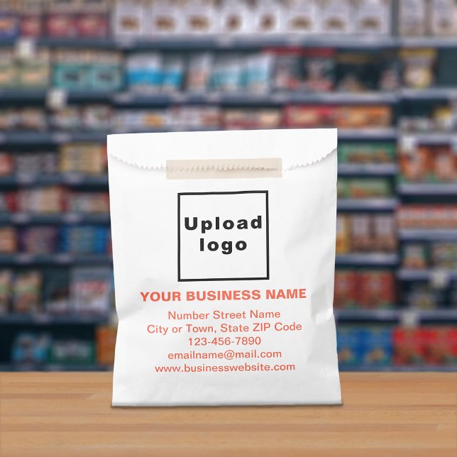 Orange Text Business Brand on Paper Bag (Paper bag with orange text business branding displayed in a store)