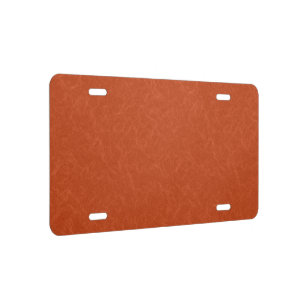 Orange textured surface with swirling pattern license plate
