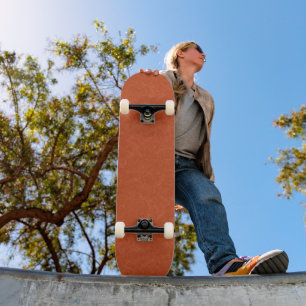 Orange textured surface with swirling pattern skateboard
