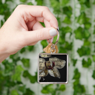 Orchid Floral Blossom Word Cloud over Black Keychain