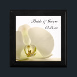 Orchid Flower on White Wedding Gift Box<br><div class="desc">Customize the pretty Orchid Flower on White Wedding Gift Box with the personal names of the bride and groom and marriage ceremony date to create a personalized keepsake gift for the newlyweds or a thank you gift for your wedding attendants, bridesmaids and bridal party. This elegant custom flowery trinket box...</div>