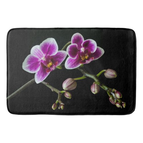 Orchid pink white color on black pale gentle  bath mat