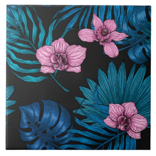 Orchids and palm leaves, pink and blue on black ceramic tile