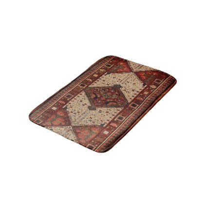 Oriental carpet design in orange and cream bath mat