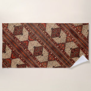 Oriental carpet pattern in orange and cream beach towel