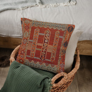 Oriental rug design in orange throw pillow