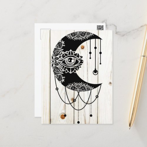 Ornate black moon eye mandala faded wood planks postcard
