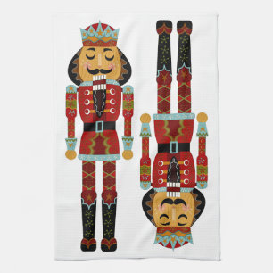 Ornate Christmas Nutcrackers on White Background Kitchen Towel