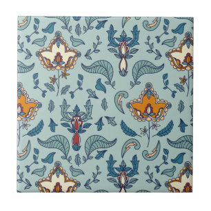 Ornate floral pattern on a pale blue background ceramic tile
