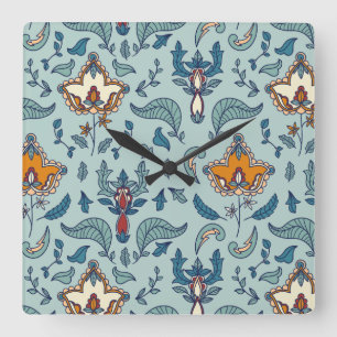 Ornate floral pattern on a pale blue background square wall clock