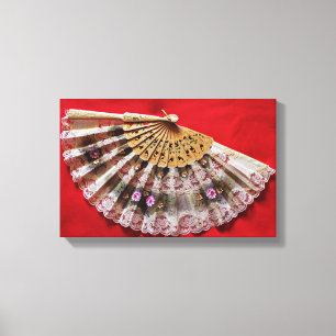 Ornate Hand Held Fan on a Red Background Canvas Print