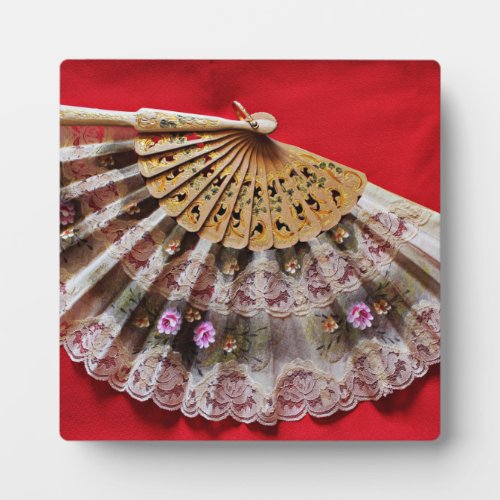 Ornate Hand Held Fan on a Red Background Plaque