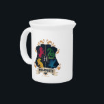 Ornate HOGWARTS™ House Crest Beverage Pitcher<br><div class="desc">HARRY POTTER™ | Check out this ornate HOGWARTS™ Crest with colorful silhouettes of the four houses!</div>