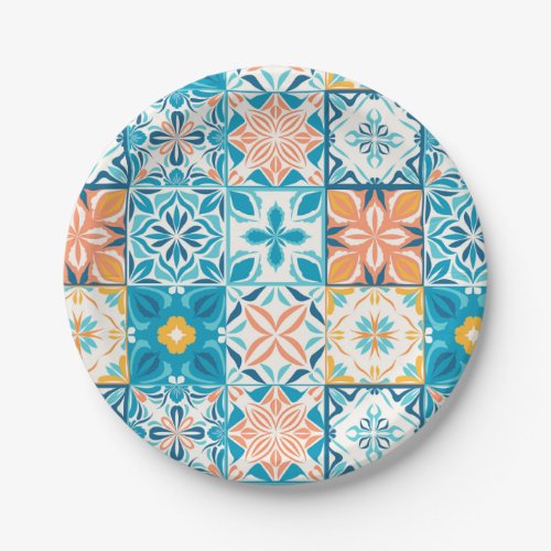 Ornate tiles in blue and orange paper plates