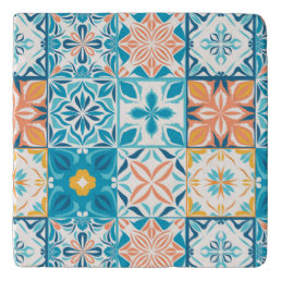 Ornate tiles in blue and orange trivet