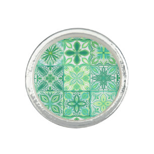 Ornate tiles in green and white ring