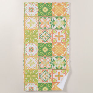 Ornate tiles in green and yellow beach towel