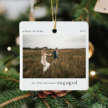 Our 1st Christmas Engaged Photo Keepsake Ceramic Ornament<br><div class="desc">A stylish photo holiday christmas tree ornament with classic typography "Our first christmas engaged" in black on a clean simple minimal white background. The photo, text, name/s and year can be easily customized to make this ornament unique and personal to you. A simple, minimalist and contemporary christmas design to announce...</div>
