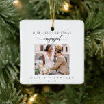 Our First Christmas As Engaged Photo Minimalist Ceramic Ornament<br><div class="desc">Celebrate your first Christmas as Mr. and Mrs. with our exquisite "Our First Christmas Engaged Minimalist Photo Ceramic Ornament. This ornament beautifully blends simplicity with sentimentality, featuring a pristine white ceramic background adorned with charming hand-drawn Christmas tree illustrations. It adds a touch of elegance and nostalgia to your holiday decor....</div>