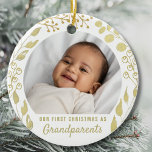 Our First Christmas As Grandpar Photo Gold Foliage Ceramic Ornament<br><div class="desc">This elegant Grandparents Christmas Ornament is decorated with watercolor gold foliage on a white background.
The text is customizable.
Please replace the photo with one of your own.
It makes a charming keepsake gift for new grandparents.
Original Watercolor © Michele Davies.</div>