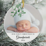 Our First Christmas As Grandparents Photo Ceramic Ornament<br><div class="desc">This cute Grandparent's First Christmas Ornament is decorated with watercolor mistletoe. Easily customizable with your baby's photo, name, and year. Use the Design Tool to change the text size, style, or color. Because we create our artwork you won't find this exact image from other designers. Original Watercolor © Michele Davies....</div>