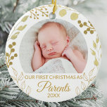 Our First Christmas As Parents Gold Foliage Photo Ceramic Ornament<br><div class="desc">This elegant Parents' Christmas Ornament is decorated with gold foliage on a white background.
Easily customizable with baby's photo and year.
Original Watercolor © Michele Davies.</div>