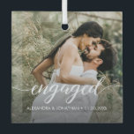 Our first Christmas Engaged Custom Photo Names  Glass Ornament<br><div class="desc">Celebrate your first Christmas together as an engaged couple with our "Our First Christmas Engaged" Custom Photo Names Glass Ornament. This exquisite glass holiday ornament is a perfect keepsake to cherish the joyous memories of this special time in your lives. The ornament features an elegant script that spells out "engaged,...</div>