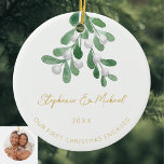 Our First Christmas Engaged Mistletoe Gold Photo Ceramic Ornament<br><div class="desc">Celebrate your first Christmas as an engaged couple with this stylish photo ceramic ornament. 
It is decorated with watercolor mistletoe and elegant gold script typography.
Easily customizable with your names,  date,  and photo.
Use the Design Tool to change the text size,  style,  or color.
Original Watercolor © Michele Davies.</div>