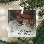 Our First Christmas Engaged Personalized Photo Glass Ornament<br><div class="desc">An elegant keepsake of your engagement year,  this beautiful glass ornament displays a favorite photo with "our first Christmas engaged" overlaid in hunter green lettering accented with stars. Personalize with your initials and the year.</div>