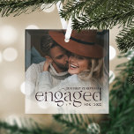 Our First Christmas Engaged Personalized Photo Glass Ornament<br><div class="desc">An elegant keepsake of your engagement year,  this beautiful glass ornament displays a favorite photo with "our first Christmas engaged" overlaid in rich plum lettering accented with stars. Personalize with your initials and the year.</div>