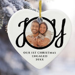 Our First Christmas Engaged Photo Heart-Shaped Ceramic Ornament<br><div class="desc">This keepsake heart-shaped First Christmas Engaged photo ceramic ornament is decorated with the word JOY in stylish black script typography. Easily customizable.</div>