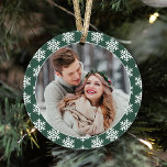 Our First Christmas Green Snowflake Photo Ornament<br><div class="desc">This modern holiday keepsake ornament features a photo of the newlywed couple on the front framed by a dark green border color with contrasting pattern of white winter snowflakes. The back of the design includes the same color scheme with "Our First Christmas" wording and a custom monogram of their names...</div>