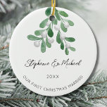 Our First Christmas Married  Ceramic Ornament<br><div class="desc">Celebrate your first Christmas as an engaged couple with this stylish ceramic ornament. 
It is decorated with watercolor mistletoe and elegant script typography.
Easily customizable.
Use the Design Tool to change the text size,  style,  or color.
Original Watercolor © Michele Davies.</div>