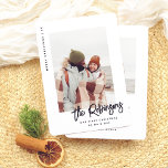 Our First Christmas Modern Married Newlywed Photo Holiday Card<br><div class="desc">Celebrate your first Christmas as newlyweds with this fun photo card! The design features “Merry Christmas” and the year running down the left side, leaving the spotlight for your favorite photo. You can use a wedding photo, a honeymoon snapshot, or a cute selfie! Your family name or names are written...</div>