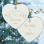 Our First Christmas Mr Mrs Gold Love Heart Script Ceramic Ornament<br><div class="desc">Featuring modern gold love heart script typography,  this chic our first Christmas keepsake ornament can be personalized with your married name,  date and first names or monogram initials on the reverse. Designed by Thisisnotme©</div>