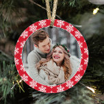 Our First Christmas Red Snowflake Photo Ornament<br><div class="desc">This modern holiday keepsake ornament features a photo of the newlywed couple on the front framed by a red color with contrasting pattern of white winter snowflakes. The back of the design includes the same color scheme with "Our First Christmas" wording and a custom monogram of their names and the...</div>