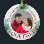 Our First Christmas Together Custom Photo Holly Ceramic Ornament<br><div class="desc">"Our first Christmas together" - personalized Christmas ornaments are a lovely keepsake to have as part of your Christmas decor. The template is set up ready for you to personalize the ornament with your photo, your names and the year. The design elegant typography and sprays of holly, mistletoe and sprigs...</div>