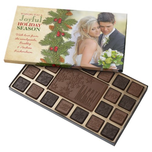Our First Christmas Together Wedding Boughs 45 Piece Box Of Chocolates - All the text and the wedding photograph on this couple's or newlywed's first Christmas together pine boughs and berries holiday greeting wedding photo gift box of chocolates is fully customizable. This is a beautiful traditional red and green Christmas photo gift box of chocolates from the newlywed couple. Pine boughs, pine cones, and red holly berries on an aged, vintage parchment paper.