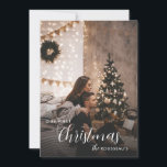 Our First Christmas Urban Romantic Photo Card<br><div class="desc">Celebrate your first holiday season together with this cozy and romantic Christmas photo card. Set in a softly lit urban apartment, the design captures the quiet intimacy of new traditions: twinkling lights, modern decor, and love in the air. Personalize with your favorite photo and names to create a heartfelt keepsake....</div>
