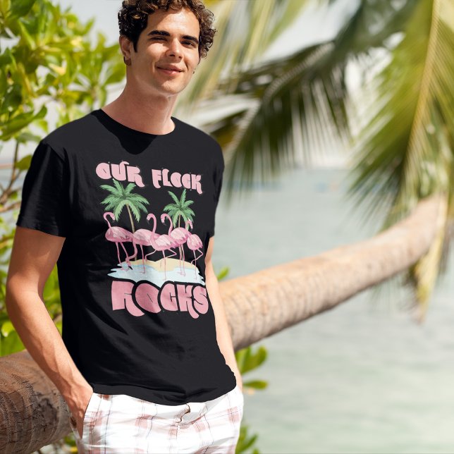Our Flock Rocks Flamingos Matching Family Group T-Shirt (young man in tropical beach setting wearing pink flamingo Our Flock Rocks family reunion t-shirt)