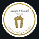 Our Love Is Poppin Popcorn Wedding Favor Classic Round Sticker<br><div class="desc">Super cute popcorn themed wedding favor sticker. Design features a popcorn container with popcorn in faux gold glitter. Below the popcorn is text in the same faux gold glitter font that says Our Love Is Poppin'. Above the golden bucket of popcorn is customizable text in dark grey font where you...</div>