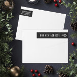 Our New Address Modern Black and White Arrow Wrap Around Label<br><div class="desc">Return address wrap-around labels feature white modern "Our New Address" wording with an arrow pointing to custom name and return address text that can be personalized on the flip side of the envelope. Black background color can be customized to any other color that coordinates with your mailing.</div>