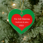 Our Second Christmas Together Cute Red Heart 2023  Ceramic Ornament<br><div class="desc">Personalized names and printed with cute red heart design in solid green background. Feel free to customize by adding your own texts,  names or photos. You can add your photo on the back side of the ornament easily!
The color of the background can also be changed as you want.</div>