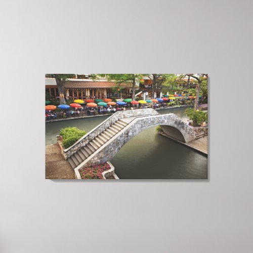 Outdoor cafe along River Walk and bridge over 2 Canvas Print