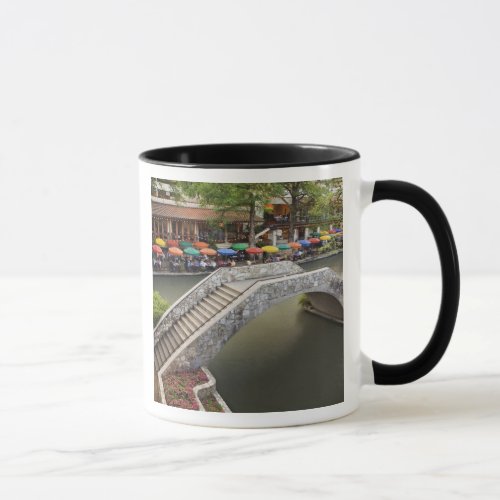 Outdoor cafe along River Walk and bridge over 2 Mug